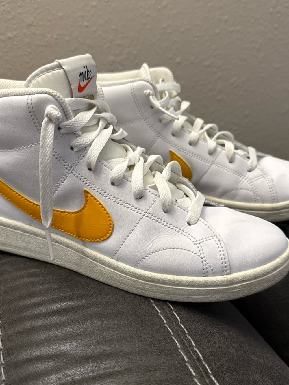 Nike Women's White High-Top Sneakers with Yellow Swoosh Blazers
